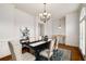 Elegant dining room with hardwood floors, wainscoting, and a chandelier at 3331 Vintage Se Cir, Smyrna, GA 30080