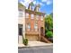 Beautiful brick house with dormer windows, a two-car garage, and stone walkway at 3331 Vintage Se Cir, Smyrna, GA 30080