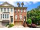 Charming brick townhome with a two-car garage and beautifully landscaped front yard at 3331 Vintage Se Cir, Smyrna, GA 30080