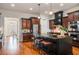 Elegant kitchen featuring stainless steel appliances, hardwood floors, and dark cabinetry at 3331 Vintage Se Cir, Smyrna, GA 30080