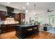 Spacious kitchen with a large island, stainless steel appliances, and dark wood cabinetry at 3331 Vintage Se Cir, Smyrna, GA 30080