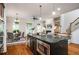 Open concept kitchen with a large center island, stainless steel appliances, and views into the living area at 3331 Vintage Se Cir, Smyrna, GA 30080