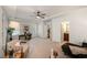 Sunlit living room boasts an open concept, neutral carpet, and a ceiling fan at 3331 Vintage Se Cir, Smyrna, GA 30080