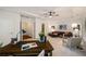 Open living room offers bright spaces with a ceiling fan and neutral carpet at 3331 Vintage Se Cir, Smyrna, GA 30080