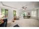 Inviting living room filled with natural light, neutral carpet, and a ceiling fan at 3331 Vintage Se Cir, Smyrna, GA 30080