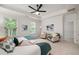 Sunlit main bedroom with sitting area, soft decor, and views of the lush outdoors at 3331 Vintage Se Cir, Smyrna, GA 30080