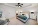A bright main bedroom showcases a tray ceiling, neutral walls, and plush carpet at 3331 Vintage Se Cir, Smyrna, GA 30080