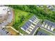 Aerial view of the townhome community featuring a mix of residential units and green spaces at 6125 Langdon Way, Cumming, GA 30028