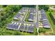 Aerial view of townhomes showcasing well-maintained landscaping and private backyards in a neatly planned community at 6125 Langdon Way, Cumming, GA 30028