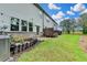 Backyard featuring a manicured lawn and landscaped area, ideal for relaxation at 6125 Langdon Way, Cumming, GA 30028