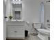 Well-lit bathroom with single vanity, modern fixtures, and tiled floors at 6125 Langdon Way, Cumming, GA 30028