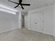 Bedroom with ceiling fan, neutral walls, plush carpet, and ample closet space at 6125 Langdon Way, Cumming, GA 30028