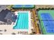 Aerial shot of a community pool featuring pristine blue water, surrounded by lounge chairs and well-kept landscaping at 6125 Langdon Way, Cumming, GA 30028