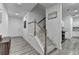 Clean entryway with white stairs and walls, providing a bright and welcoming feel at 6125 Langdon Way, Cumming, GA 30028