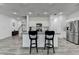 Bright kitchen with stainless steel appliances, granite countertops, and a center island with seating at 6125 Langdon Way, Cumming, GA 30028