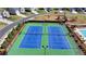 Close up aerial view of community tennis courts, pool, and playground at 6125 Langdon Way, Cumming, GA 30028