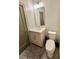Modern bathroom with light-wood vanity, sleek mirror, and toilet, offering a stylish and functional space at 1153 Reynolds Square Ln # 16, Atlanta, GA 30307