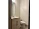 Modern bathroom featuring a sleek vanity, minimalist mirror, and a toilet, perfect for a contemporary home at 1153 Reynolds Square Ln # 16, Atlanta, GA 30307