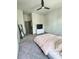 Bedroom with gray carpet, ceiling fan, dresser and TV at 1153 Reynolds Square Ln # 16, Atlanta, GA 30307