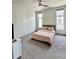 Cozy bedroom featuring a ceiling fan and natural light from two windows at 1153 Reynolds Square Ln # 16, Atlanta, GA 30307