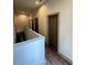 Upstairs hallway with a view of the stairwell at 1153 Reynolds Square Ln # 16, Atlanta, GA 30307