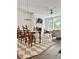 Bright living room featuring a fireplace, hardwood floors and large windows with ample natural light at 1153 Reynolds Square Ln # 16, Atlanta, GA 30307