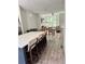 Open-concept living space featuring living room, dining room and kitchen with hardwood flooring throughout at 1153 Reynolds Square Ln # 16, Atlanta, GA 30307