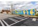 Vibrant neighborhood mural enhancing the streetscape with artistic expression, located along a quiet road at 1153 Reynolds Square Ln # 16, Atlanta, GA 30307