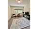 Well-lit home office with neutral carpet, large windows, and a simple desk setup at 1153 Reynolds Square Ln # 16, Atlanta, GA 30307
