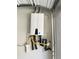 Tankless water heater installed in a garage, showcasing a space-saving and efficient system at 1153 Reynolds Square Ln # 16, Atlanta, GA 30307