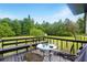 View of a back deck with outdoor seating and a lush green lawn at 18 Amanda Dr, Dallas, GA 30157