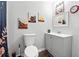 Standard bathroom with white fixtures, mirror and decorative art at 18 Amanda Dr, Dallas, GA 30157