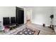 Bedroom with wood floors, black chairs and vacuum cleaner at 18 Amanda Dr, Dallas, GA 30157