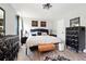 Bedroom with wooden floors, a bed and black furniture at 18 Amanda Dr, Dallas, GA 30157