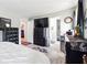 Bedroom with wooden floors, a bed and black furniture with television at 18 Amanda Dr, Dallas, GA 30157