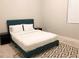 Cozy bedroom featuring a comfortable bed, neutral walls, and a decorative rug at 2132 Memorial Se Dr, Atlanta, GA 30317