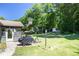 Well-maintained backyard with a patio, built-in basketball hoop, and lush greenery, offering a perfect space for outdoor enjoyment at 3335 Ivy Lake Dr, Buford, GA 30519
