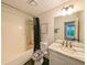 Bathroom featuring a shower with a black curtain and a marble countertop at 3335 Ivy Lake Dr, Buford, GA 30519