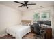 Bedroom with hardwood floors, ceiling fan, and large window at 3335 Ivy Lake Dr, Buford, GA 30519