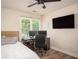 Bedroom featuring hardwood floors, ceiling fan, and large window at 3335 Ivy Lake Dr, Buford, GA 30519