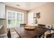 Cozy dining area with a large window providing natural light and a view of the outdoors at 3335 Ivy Lake Dr, Buford, GA 30519