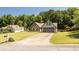 Well-maintained single-Gathering home featuring a landscaped lawn, brick accents, and a spacious two-car garage at 3335 Ivy Lake Dr, Buford, GA 30519