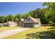 Landscaped single-Gathering home with brick accents, a two-car garage and a spacious front lawn at 3335 Ivy Lake Dr, Buford, GA 30519