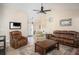Spacious living room with hardwood floors, comfortable seating, and a vaulted ceiling at 3335 Ivy Lake Dr, Buford, GA 30519