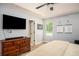 Main bedroom with dark wood dresser and a ceiling fan, offering a peaceful retreat at 3335 Ivy Lake Dr, Buford, GA 30519
