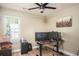 Home office with a hardwood floor, ceiling fan, and window at 3335 Ivy Lake Dr, Buford, GA 30519