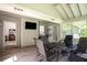 Inviting sunroom with a vaulted ceiling, neutral paint, a mounted TV, and views into the adjacent living spaces at 3335 Ivy Lake Dr, Buford, GA 30519
