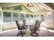 Bright sunroom features ample windows, a ceiling fan, and a seating area, perfect for relaxation and enjoying the view at 3335 Ivy Lake Dr, Buford, GA 30519