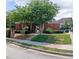 Charming brick community entrance with meticulously maintained landscaping and secure gated access for residents at 805 Pleasant Hill Nw Rd # 343, Lilburn, GA 30047