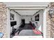 Transformed garage showcasing a well-equipped home gym with fitness equipment, rubber flooring, and ample space for workouts at 805 Pleasant Hill Nw Rd # 343, Lilburn, GA 30047